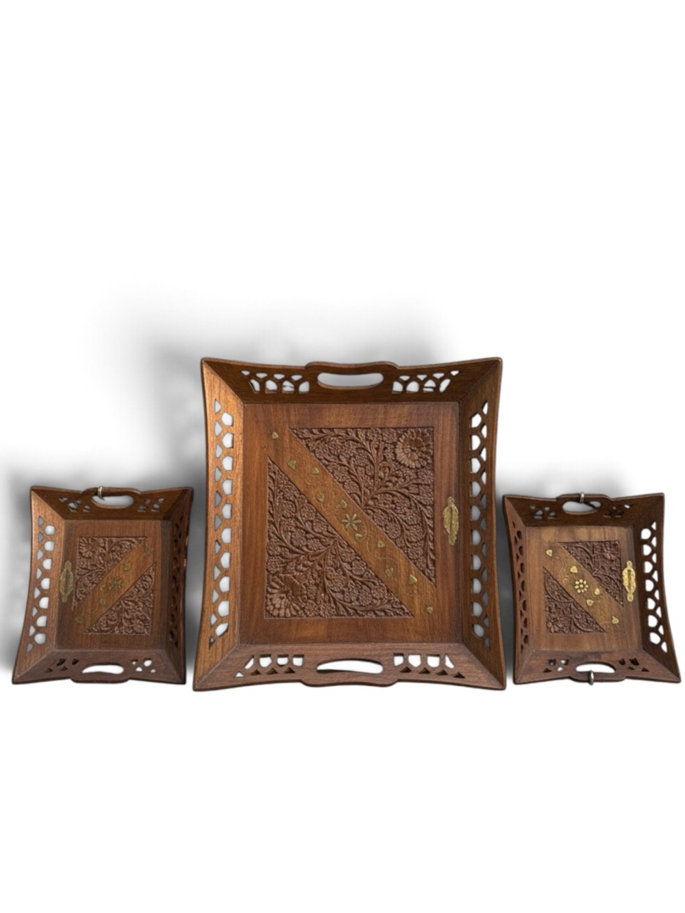 Vintage three-piece set of carved brass inlay, solid wood with floral design.